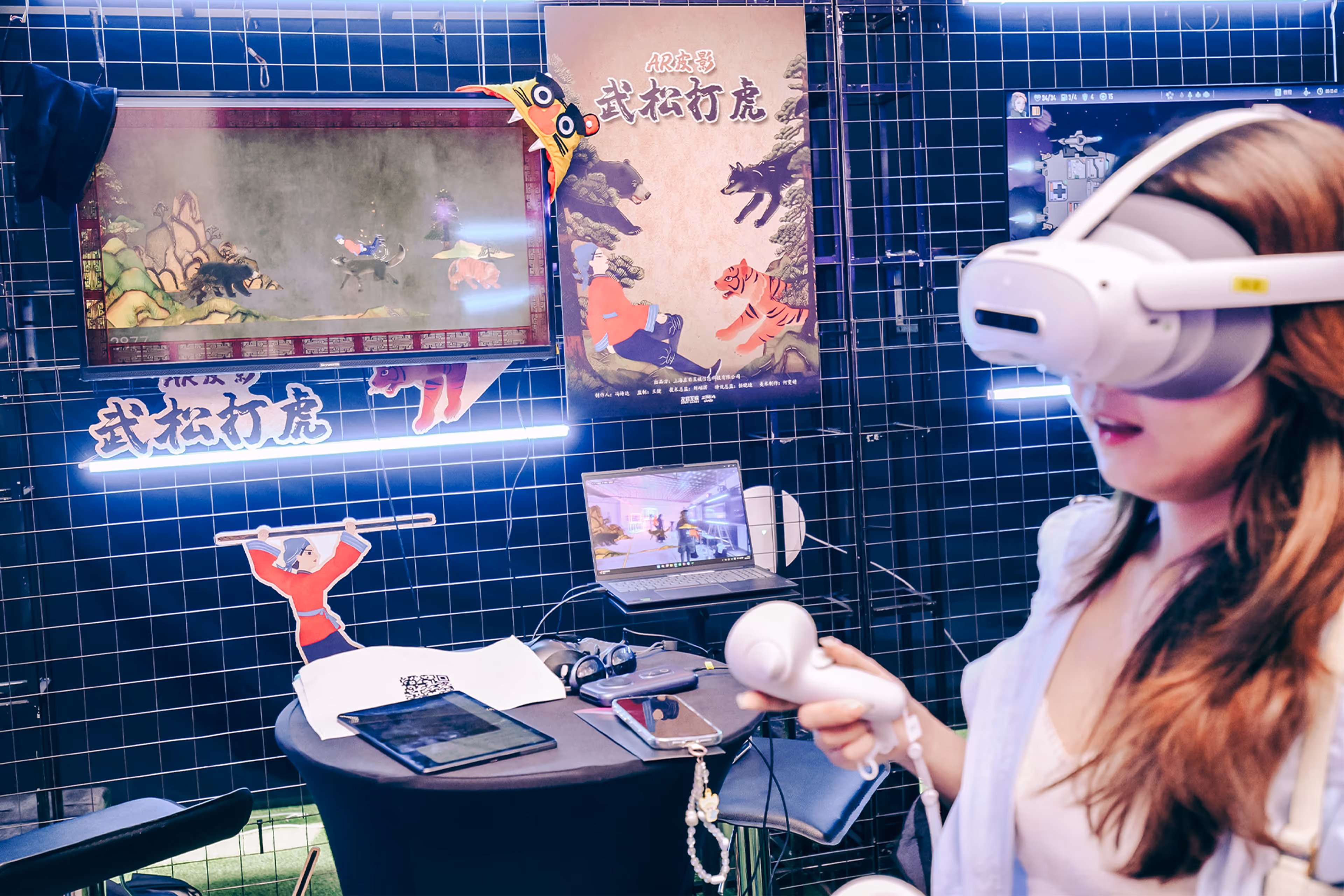 Woman using virtual reality headset and controller in a gaming booth with screens and Asian-themed graphics in the background - at AltNext Season 1 (2025).