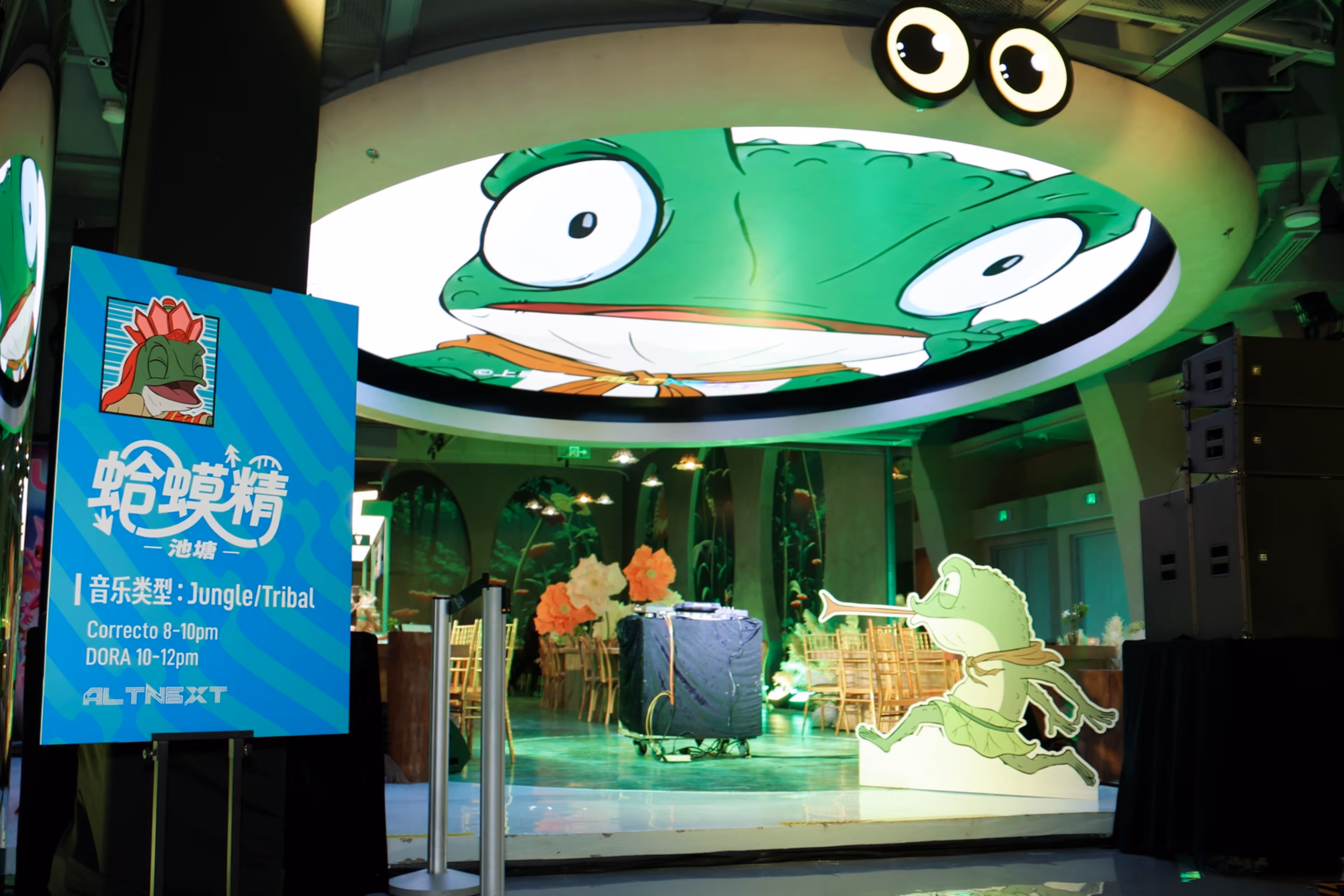 Young woman wearing a virtual reality headset and holding controllers smiles while interacting with a man in a vibrant, softly lit environment - at AltNext Edition 1 in 2025.