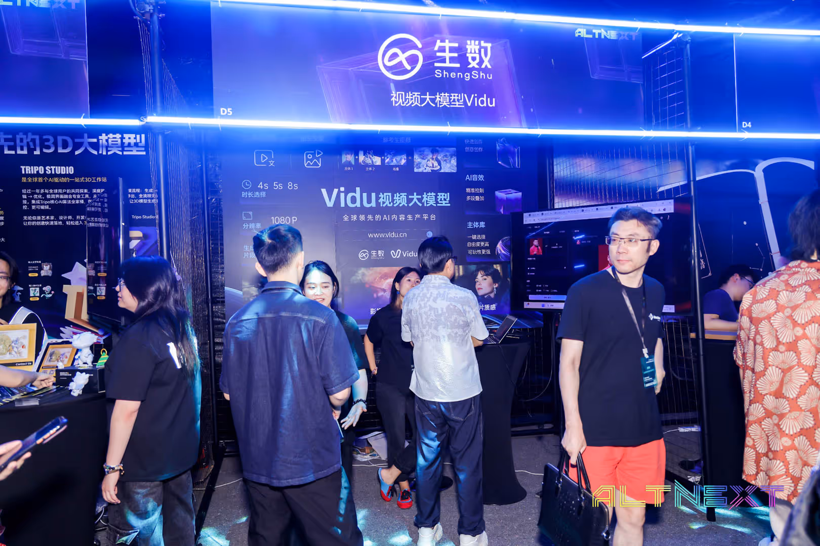 People interacting at a technology exhibition booth for ShengShu's AI video content platform Vidyu, with bright blue lights and digital displays - at AltNext Edition 1 in 2025.