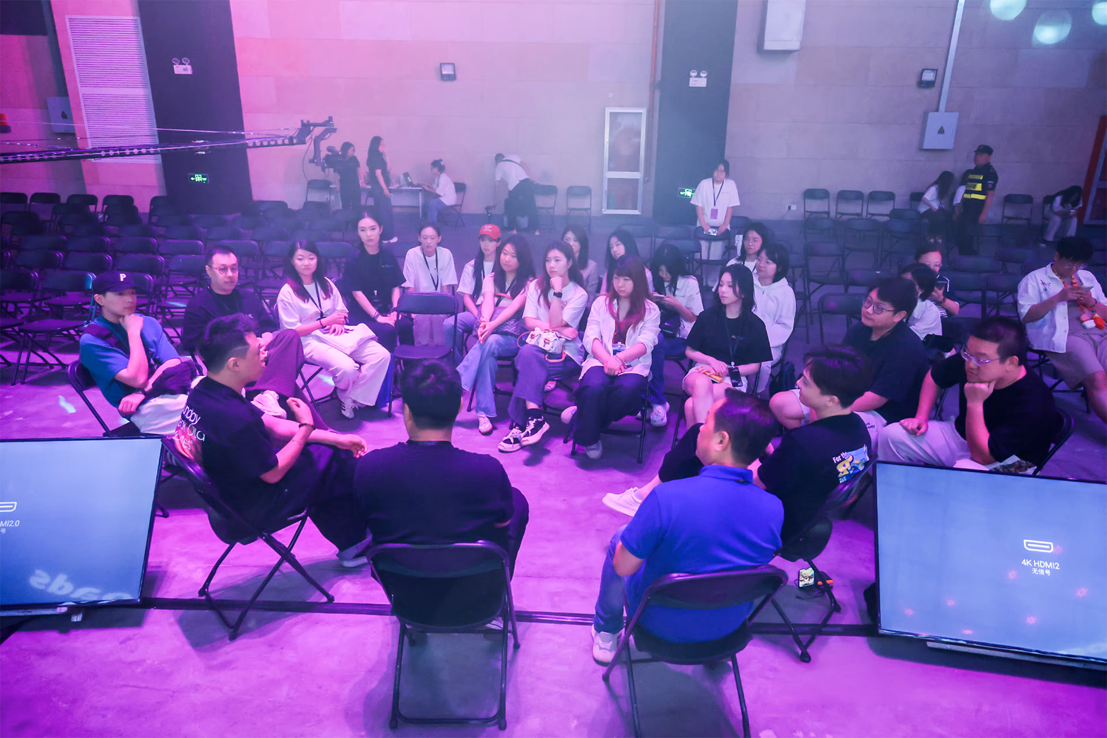 Audience seated in front of large illuminated screens displaying a presentation titled 'Choose Your Own Adventure: When Interactive Stories Take Diverging Roads' at an ALTNEXT event stage.
