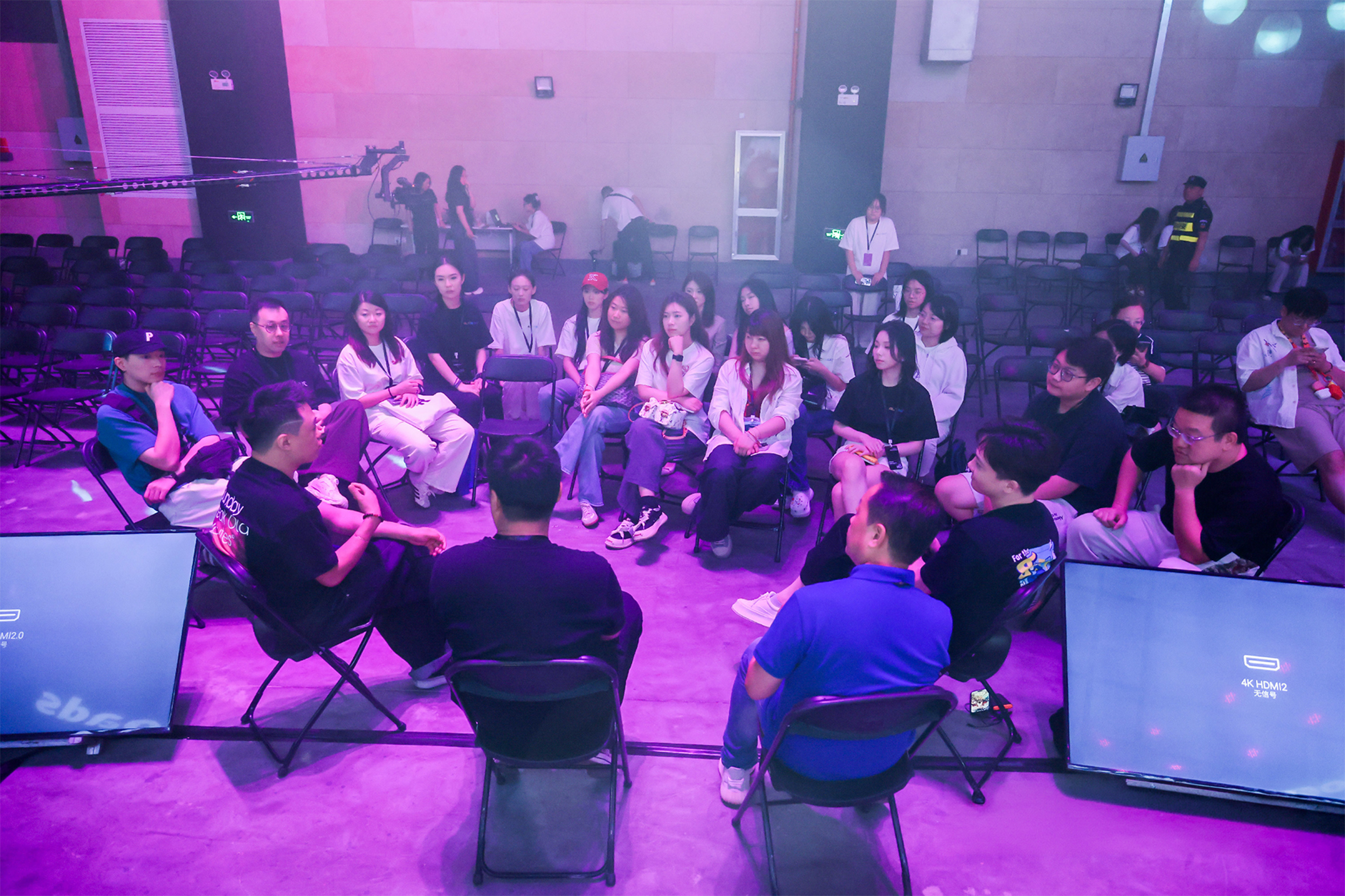 Audience seated in front of large illuminated screens displaying a presentation titled 'Choose Your Own Adventure: When Interactive Stories Take Diverging Roads' at an ALTNEXT event stage.