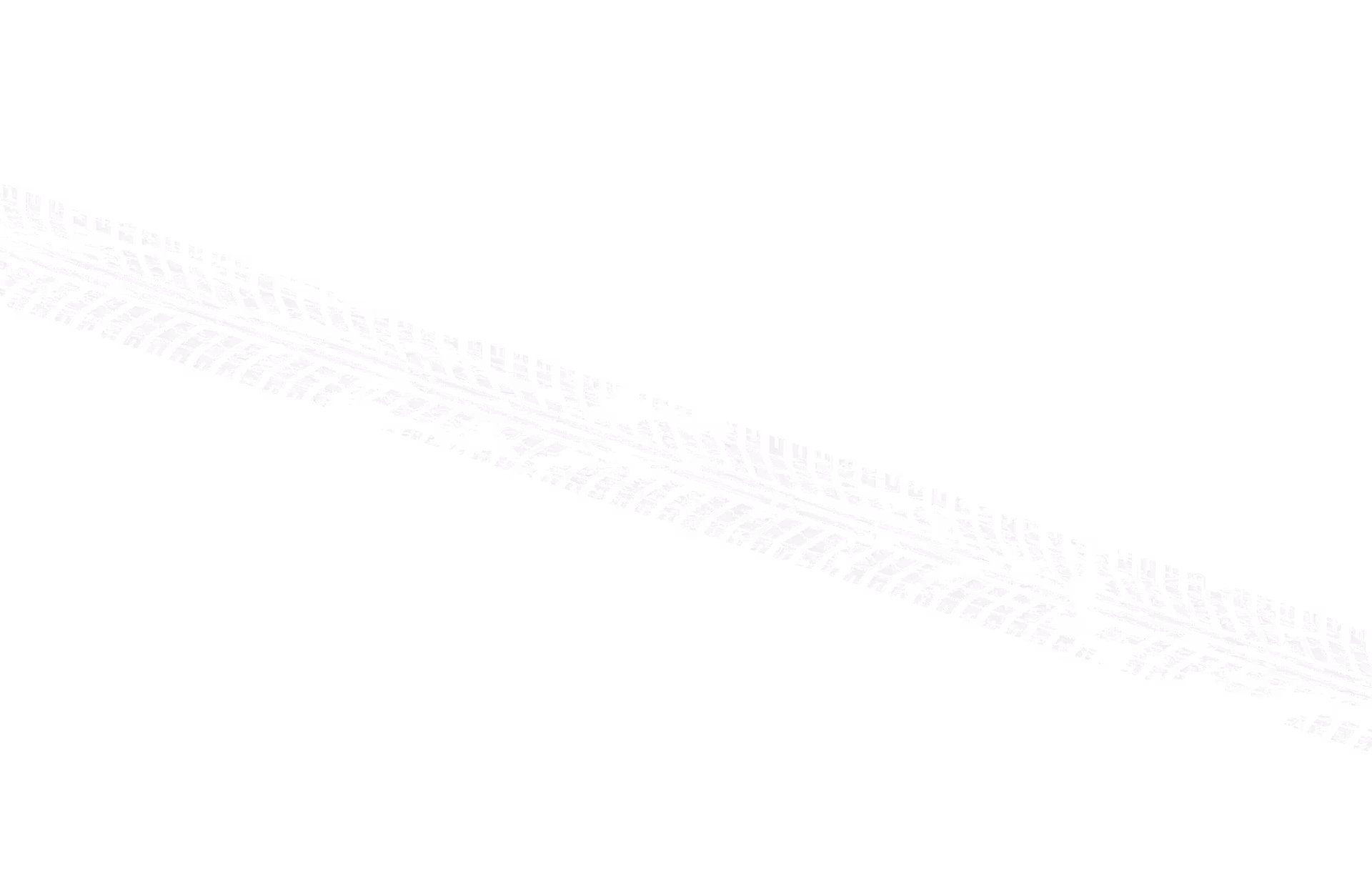 White tire tread mark on a black background, extending diagonally.