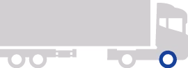 Side view of a white truck with a green frame and red lines on the axle.