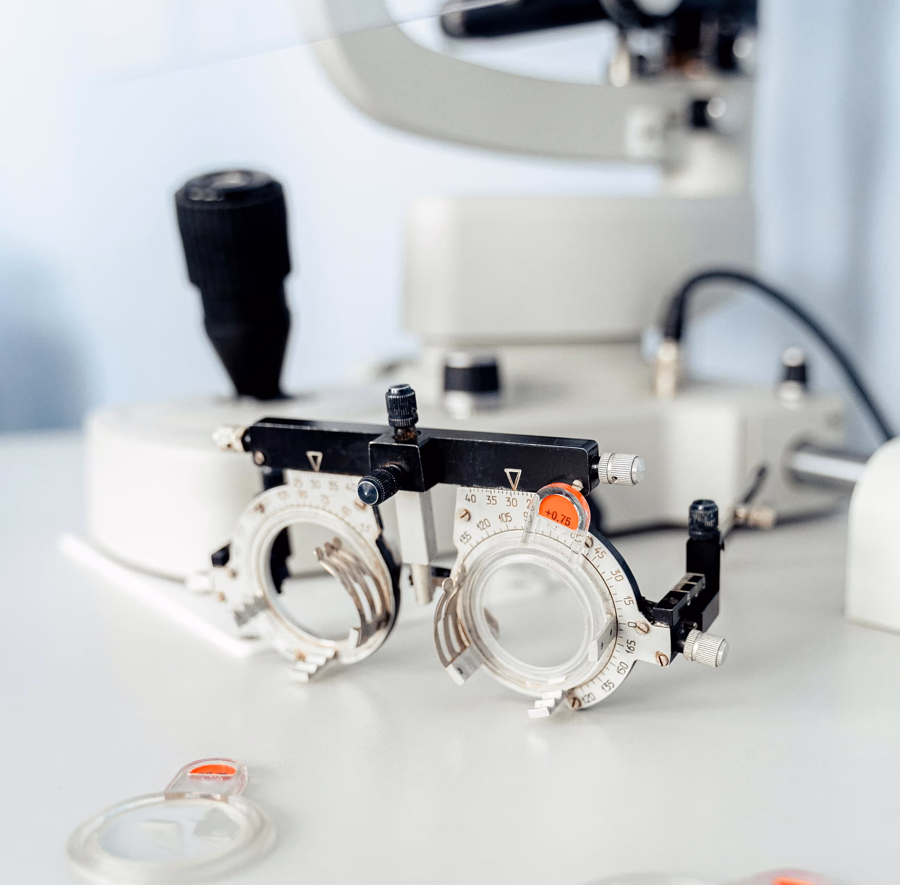 Optometry trial frame and lenses on a clinical desk, representing healthcare services and skilled professions in Australia.