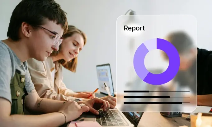 Three people working together at a table with laptops and a digital report chart overlay.