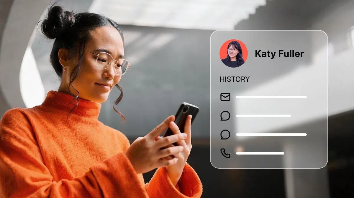 Woman in orange sweater using smartphone with digital customer profile of Katy Fuller beside her.