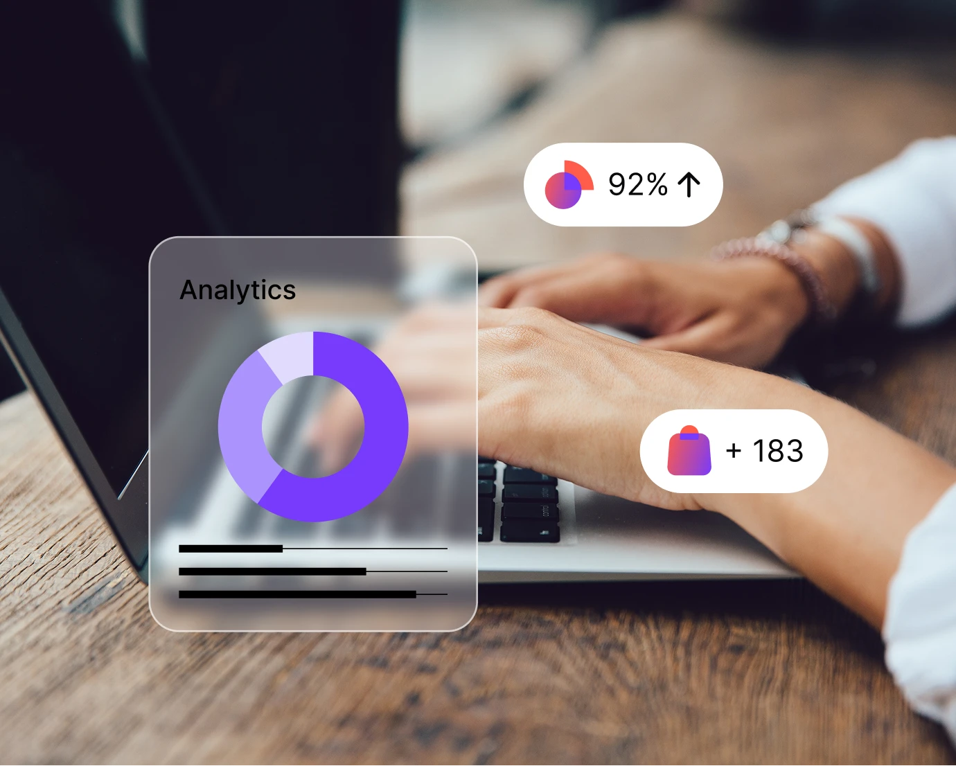 Hands typing on a laptop with overlaid graphics showing analytics and stats of 92% and 183 sales.