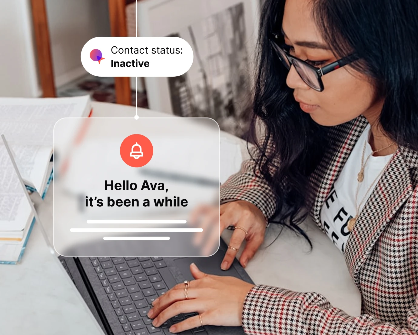 Woman with glasses typing on a laptop with a message saying 'Hello Ava, it’s been a while' and status Inactive.