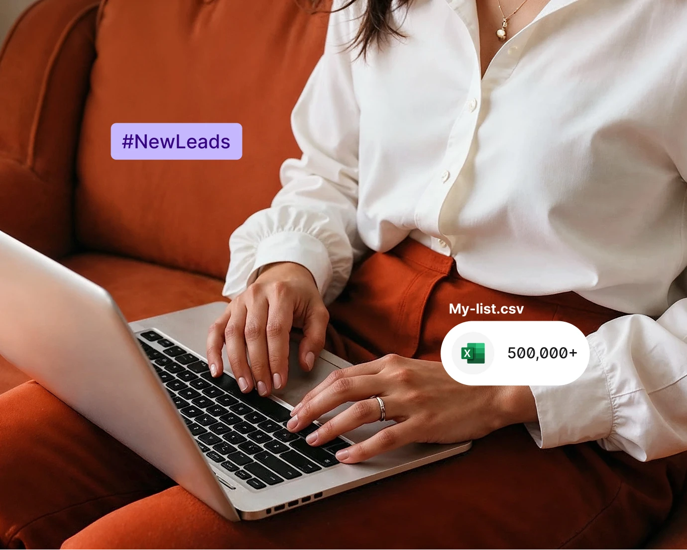 Person typing on laptop with #NewLeads text and Excel file icon showing 500,000+ contacts.