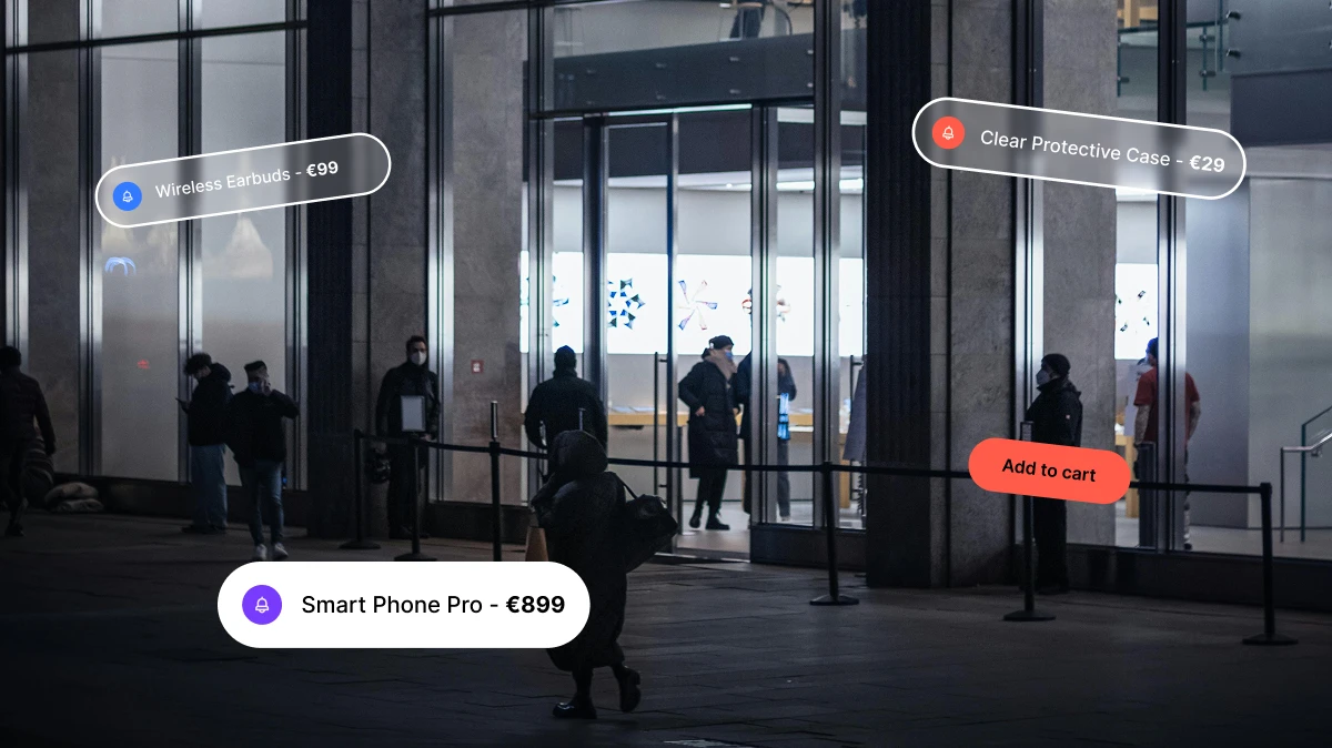 People outside a store at night with floating price tags for wireless earbuds, phone, and case.