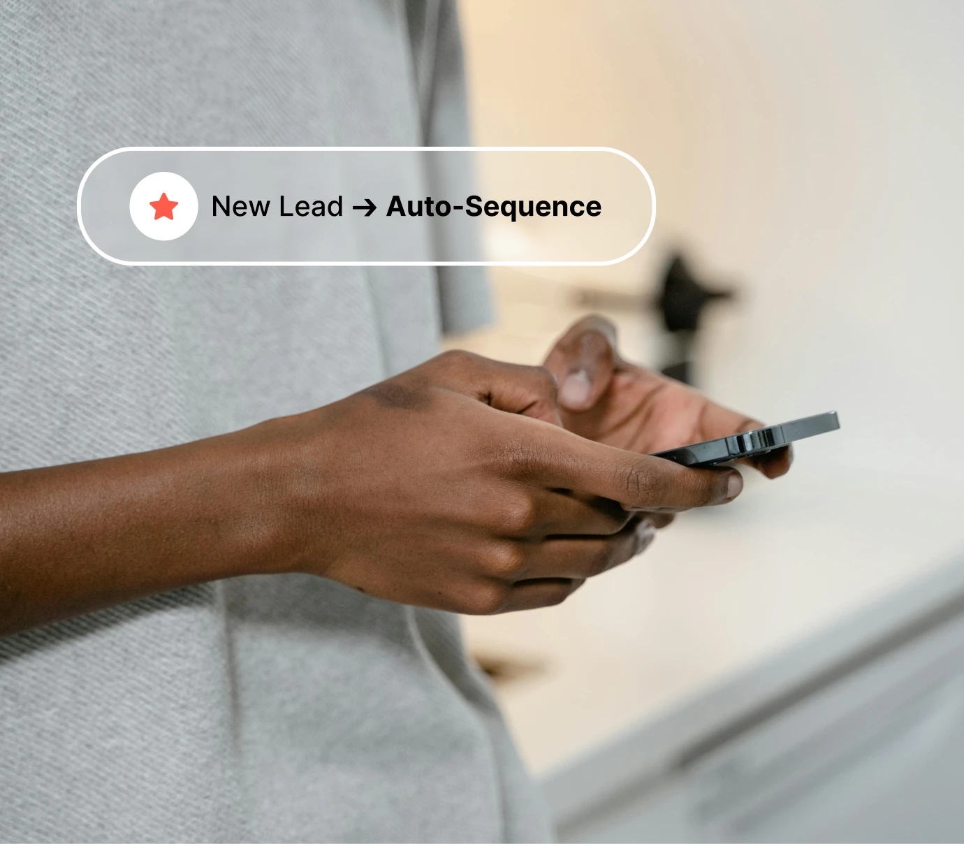 Person holding a smartphone with text overlay: New Lead to Auto-Sequence.