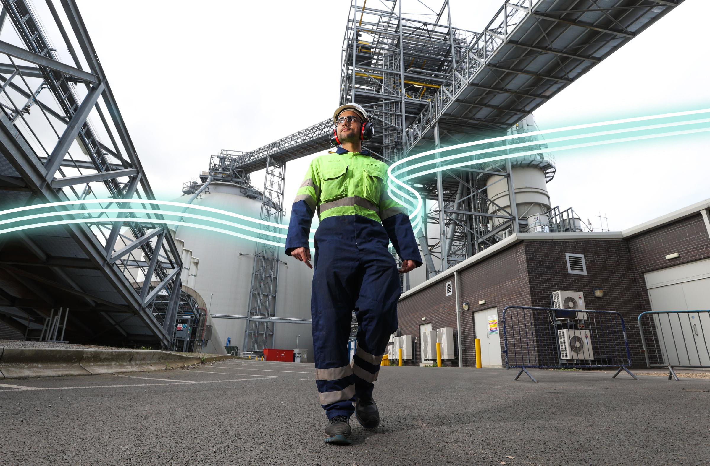 A male Drax engineer standing confidently on a worksite.