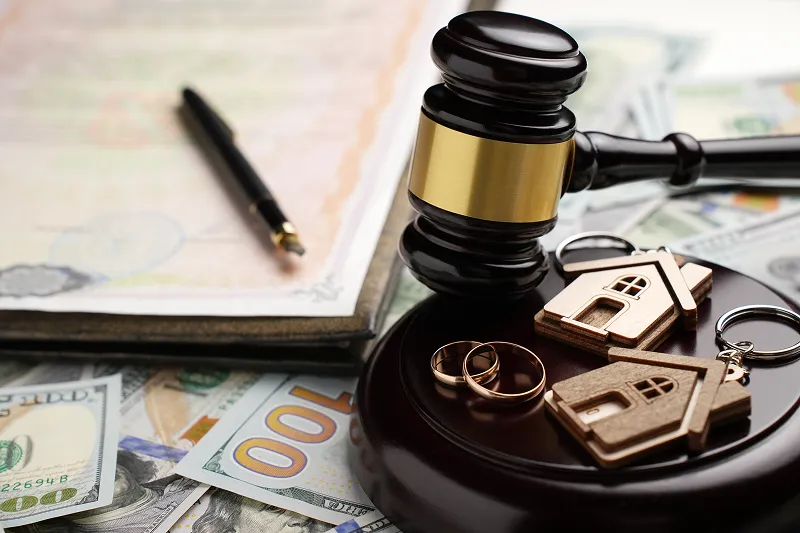 Gavel and money with paper representing a legal matter