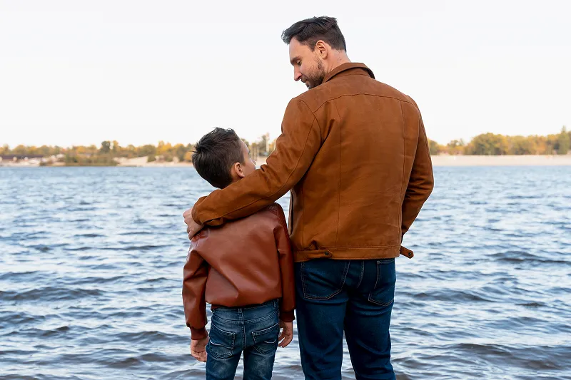 father and son at the water