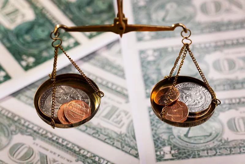 scale with money in the background