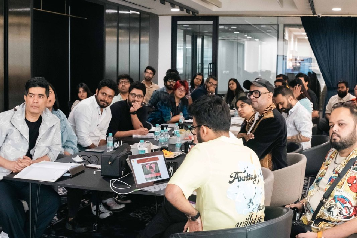Pre-production meeting for the film Bun Tikki; producer Manish Malhotra and director Faraz Arif Ansari are seen in a creative brainstorming session with the production team.