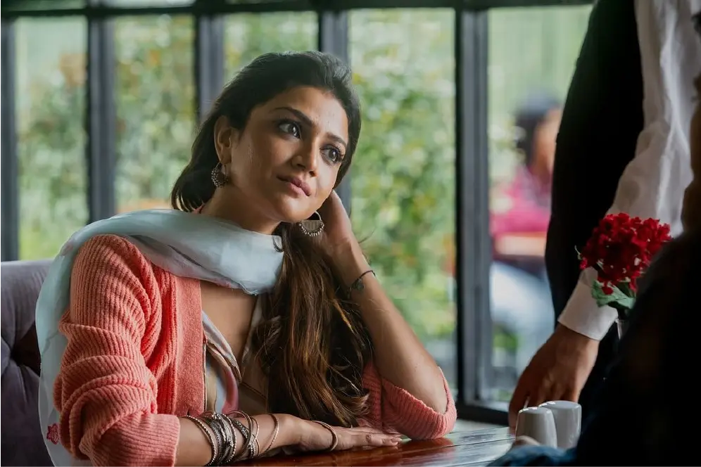 Production still of Sauraseni Maitra as Shalini in the movie Saali Mohabbat; she is wearing a floral top and looking off-camera in a domestic indoor setting.