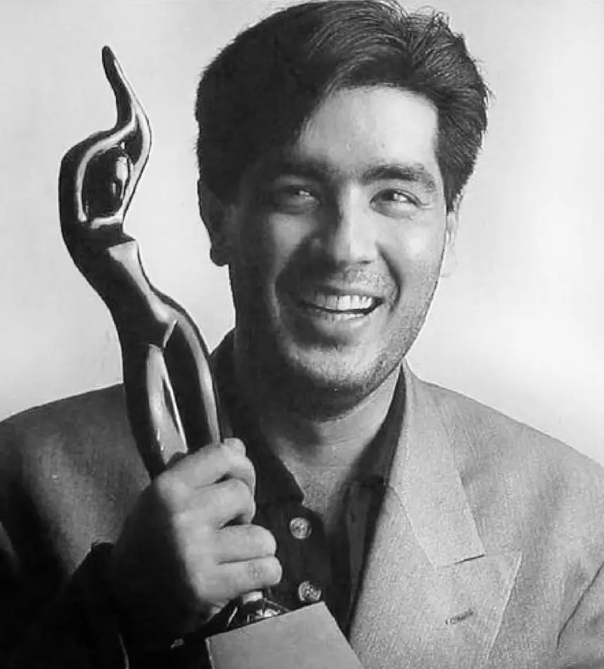 Picture of Manish Malhotra holding an award.