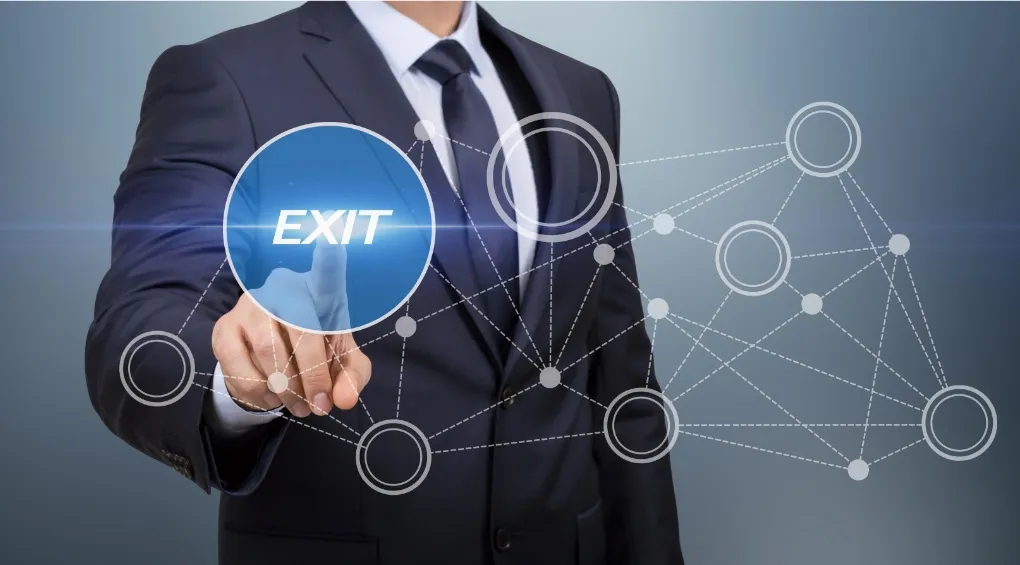 Businessman pressing virtual button labeled 'exit' with interconnected network icons in the background.