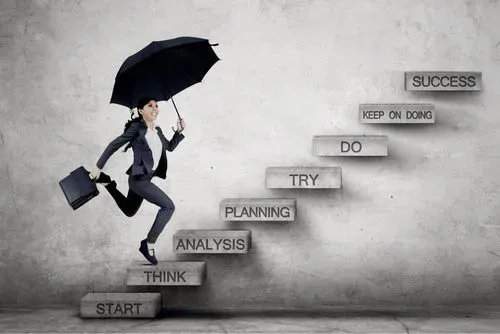 A business woman is running up the stairs with an umbrella.