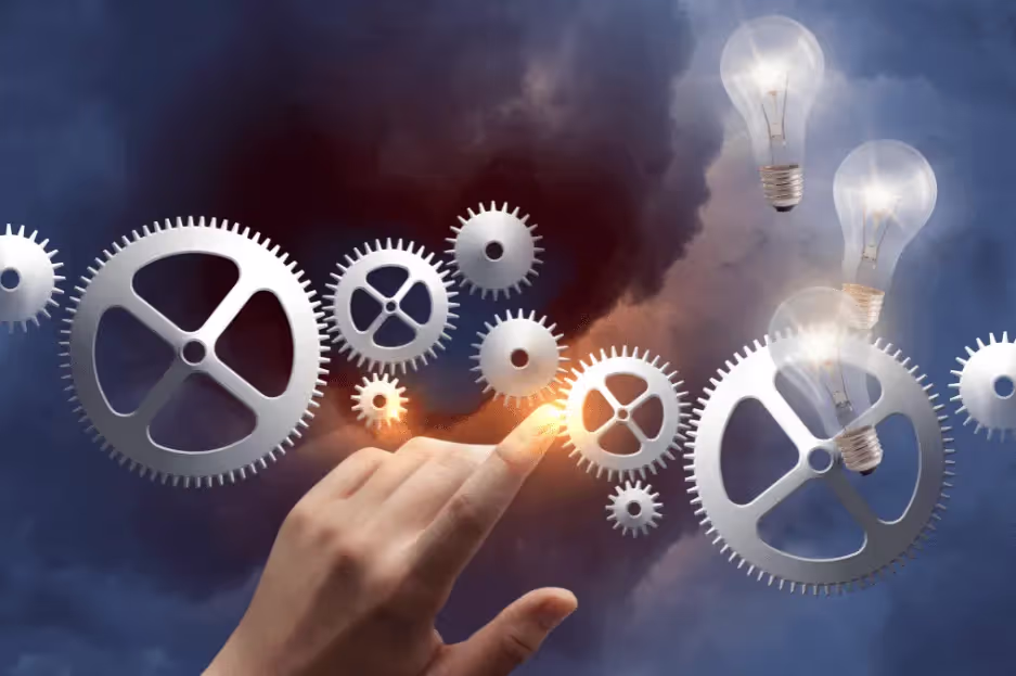 A collection of circular gears symbolizes the importance of business owners proactively planning for their business transition.