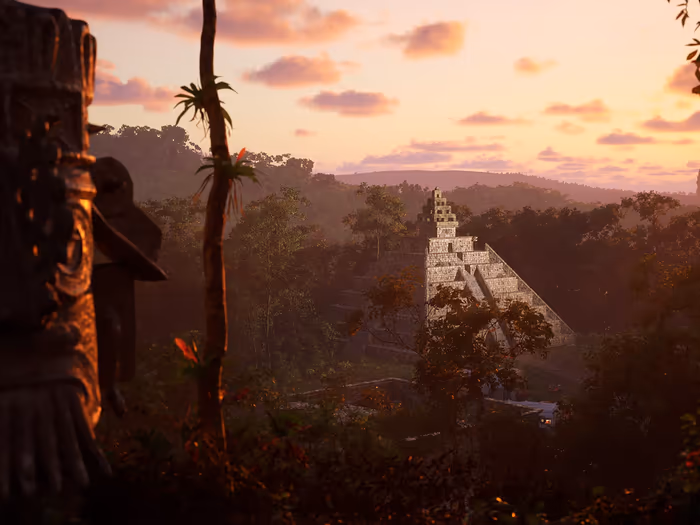 A Maya temple rising above the jungle at sunset