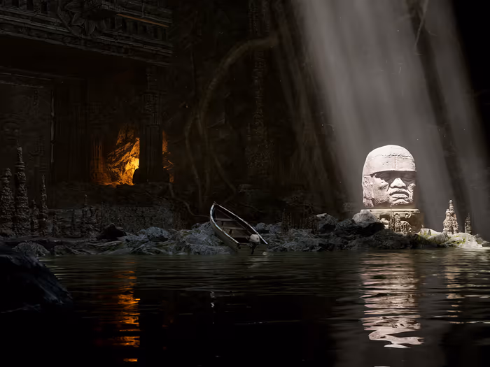An ancient stone head in a dark, flooded cave