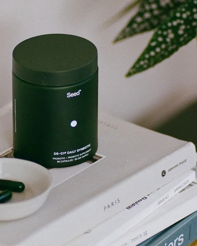 DS-01 jar and travel vial on books