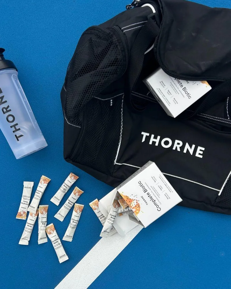 Complete Biotic stick packs beside a gym bag