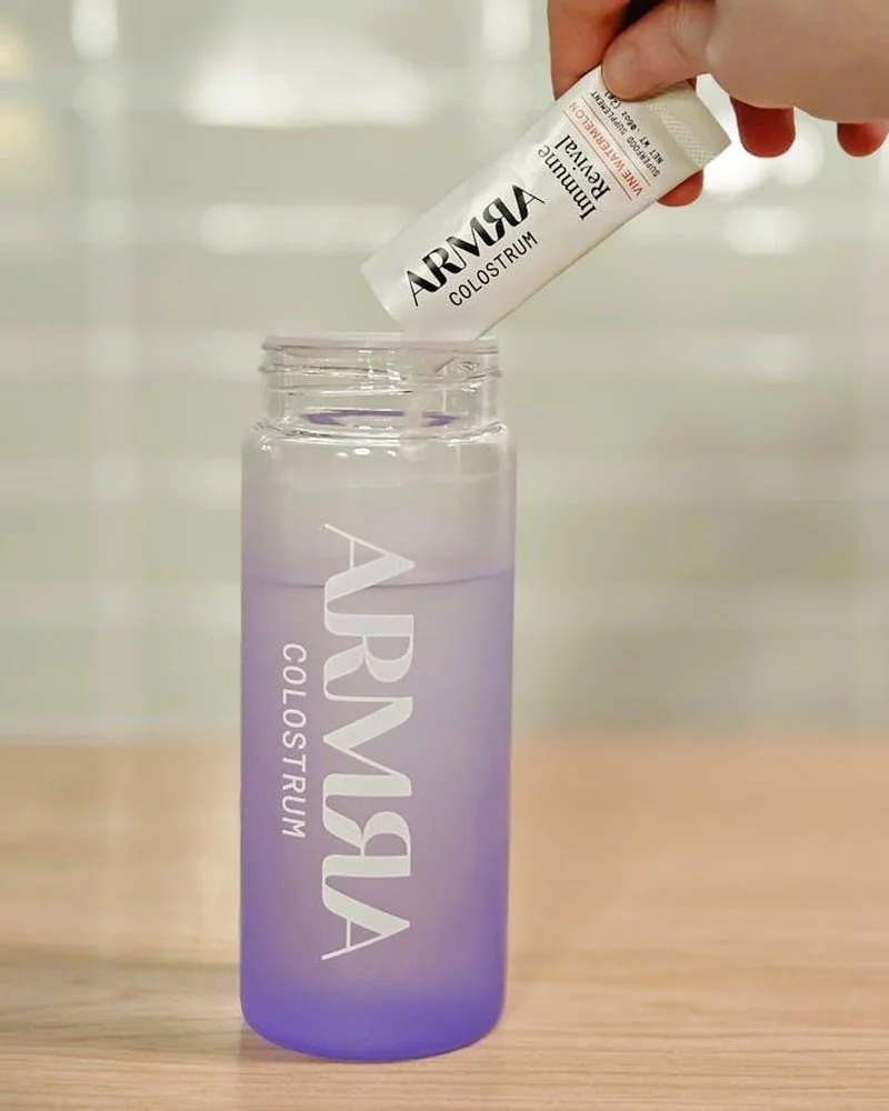 pouring ARMRA into a bottle