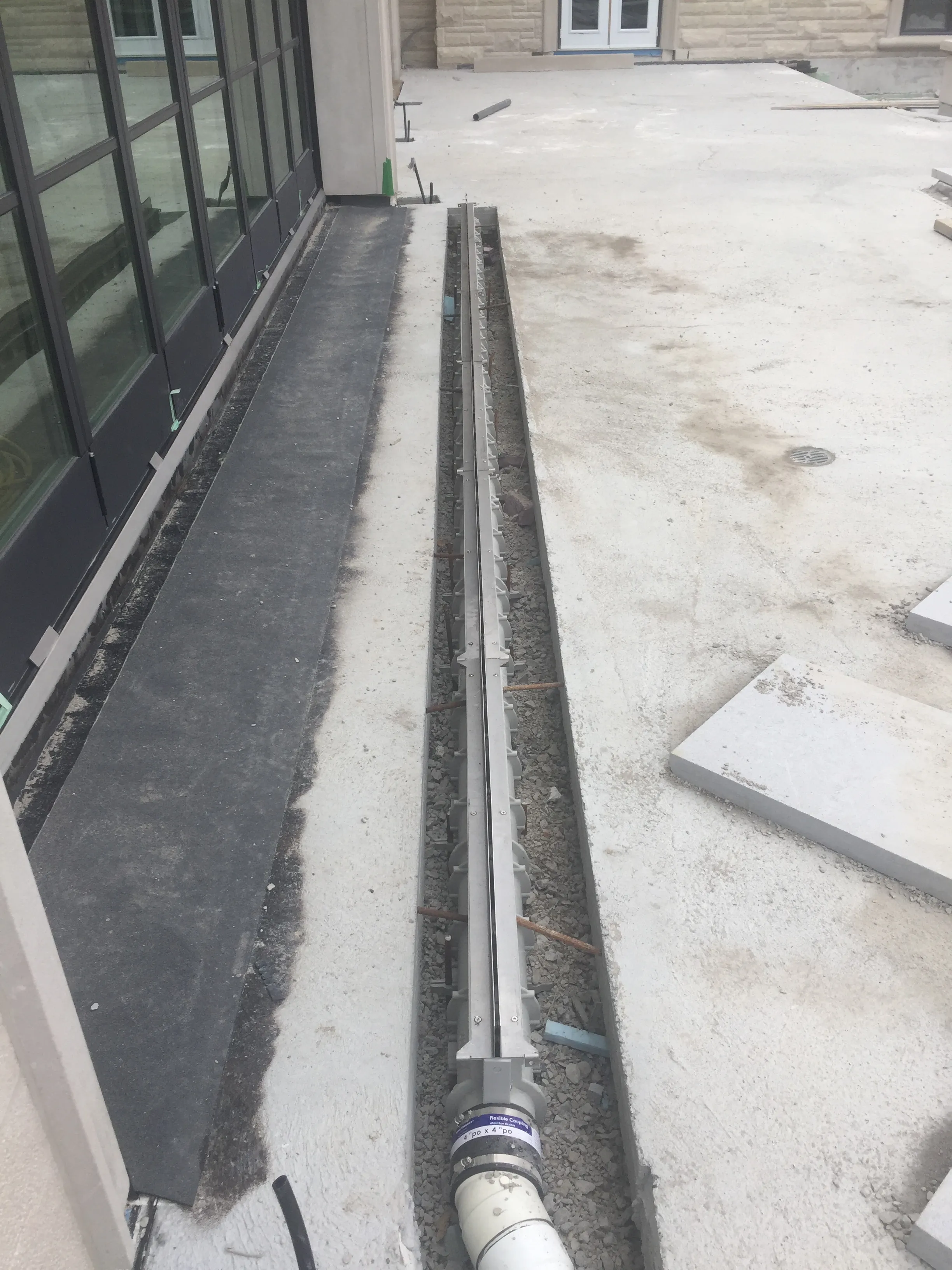 Linear trench drain installed in a concrete deck