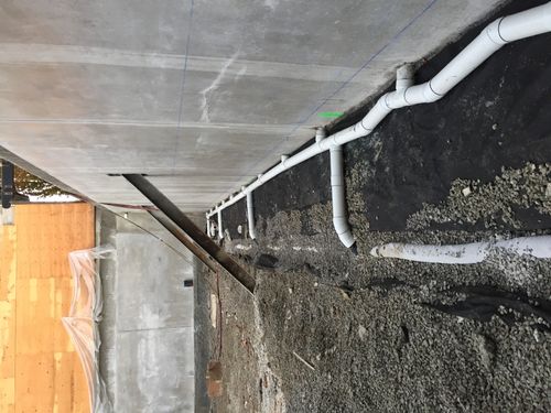 image of tools organized on a workbench (for a plumbing service)