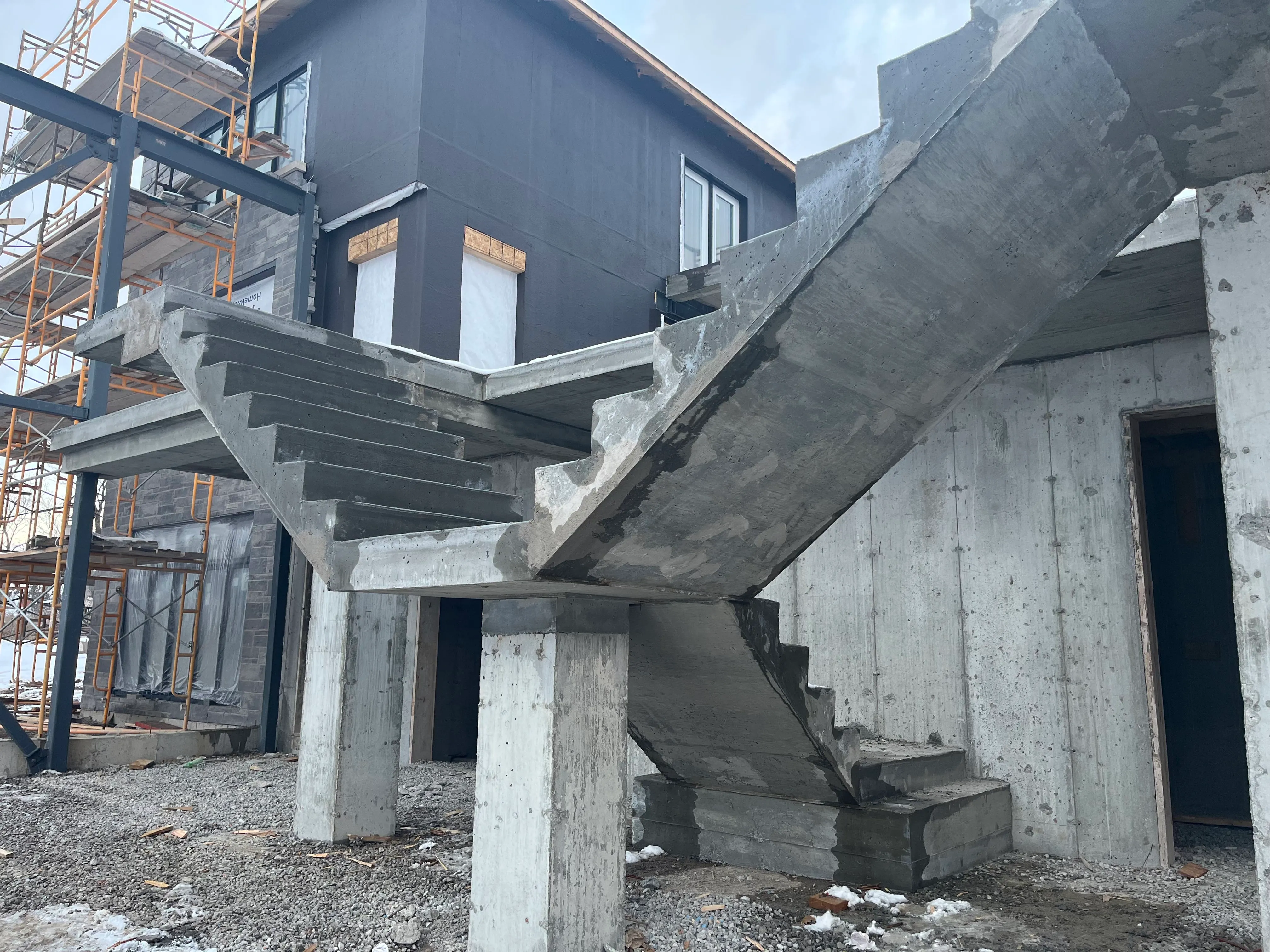 Cast-in-place concrete staircase on a modern custom home build