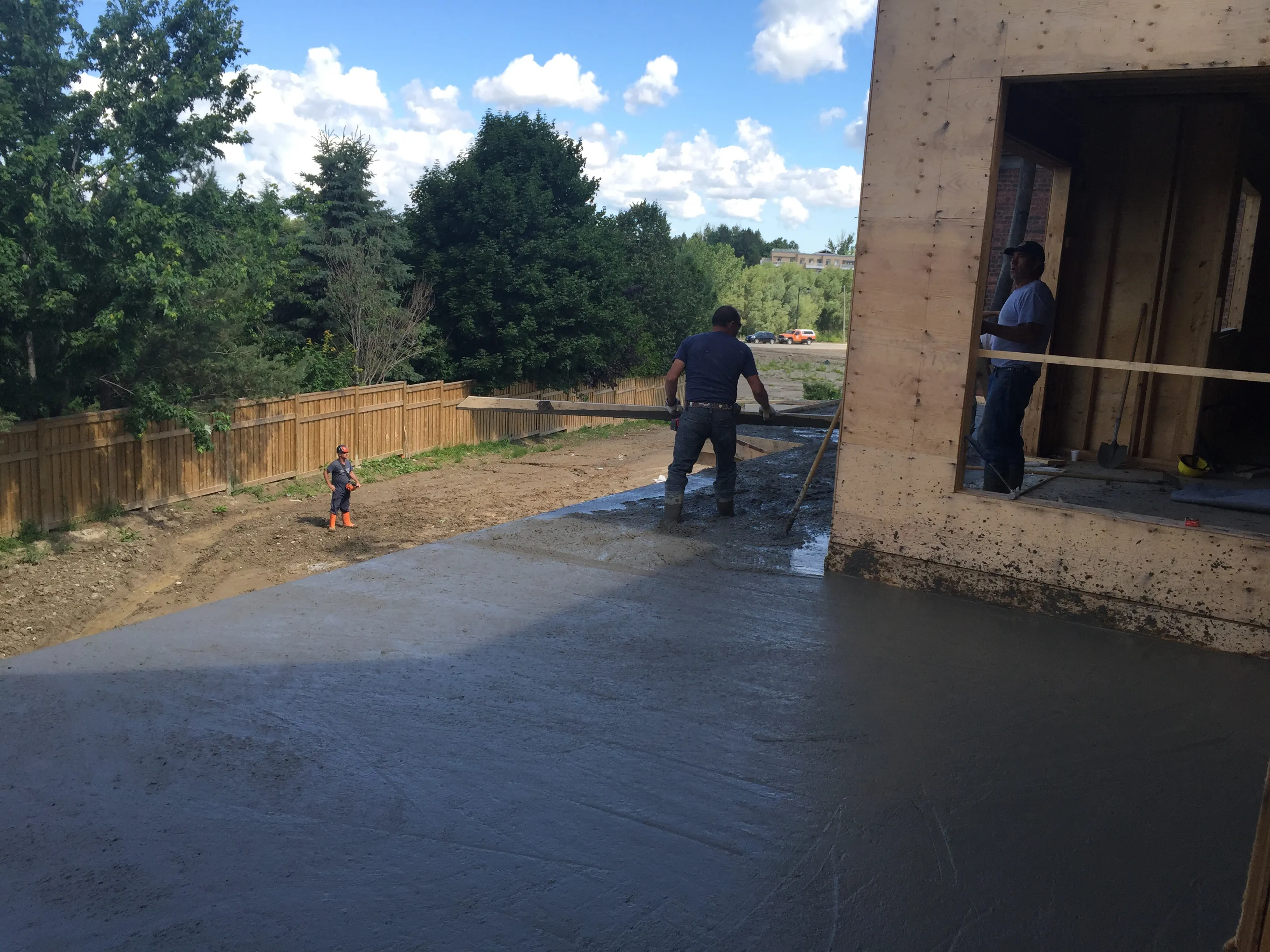 Marlisi crew placing and finishing a concrete flatwork pour