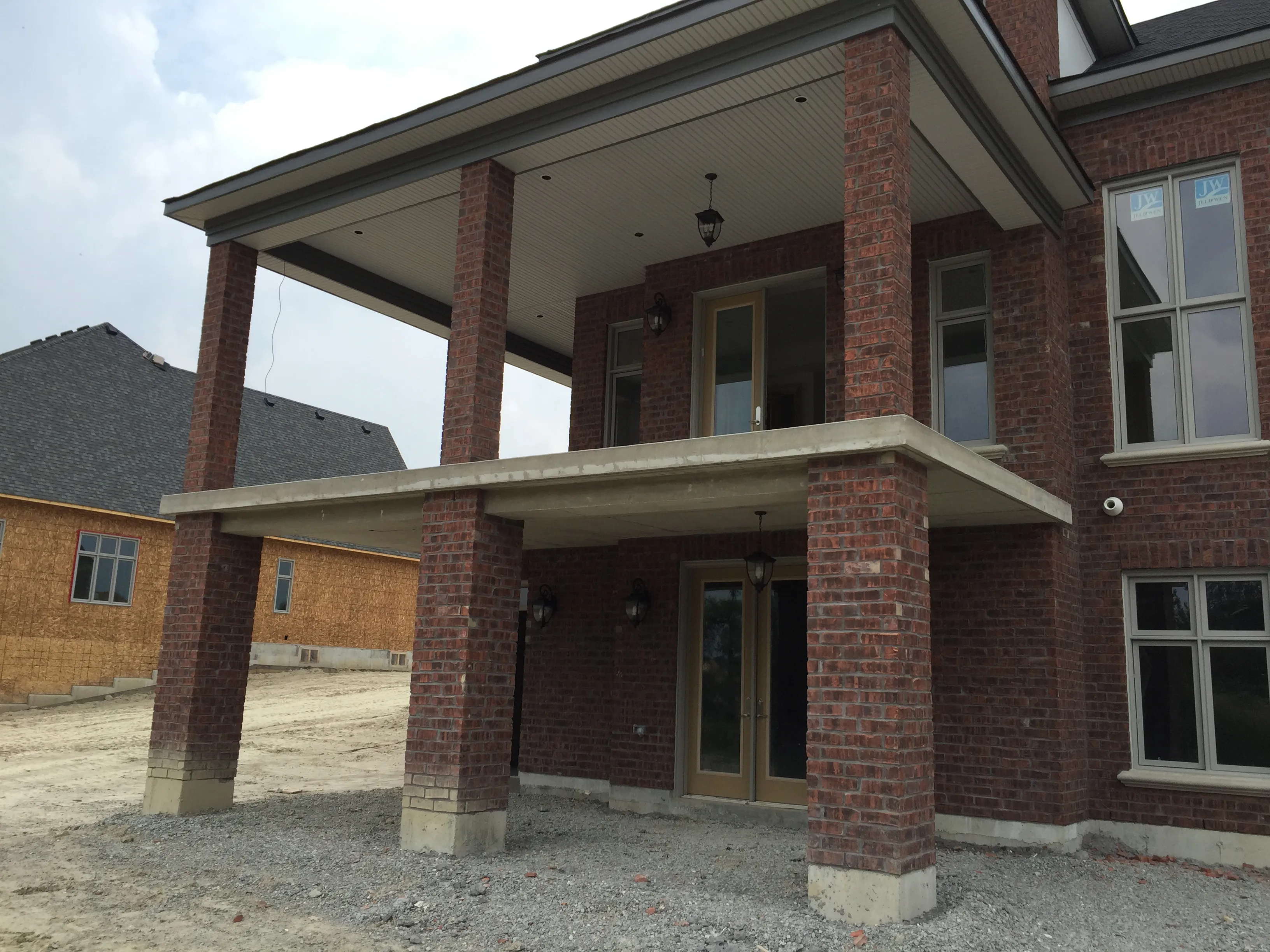 Suspended concrete porch slab on a new brick home
