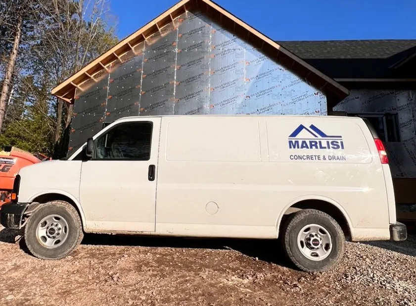 Marlisi Construction service vehicle on a residential project site
