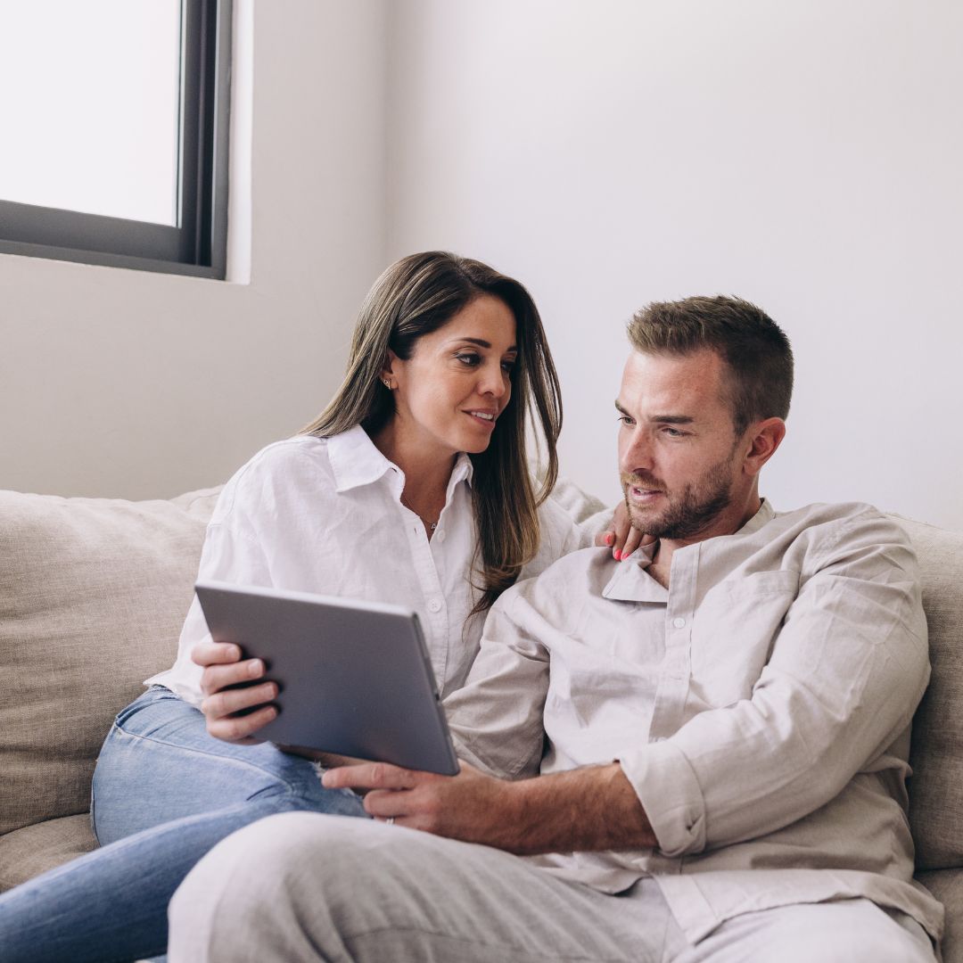 couple looking at ipad 