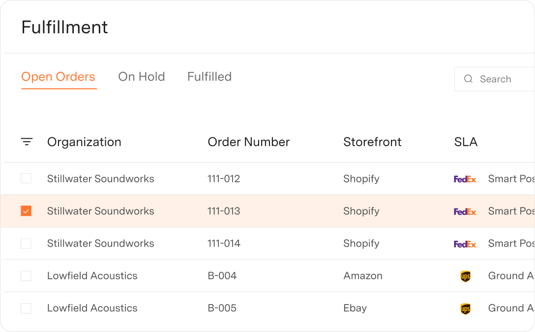 Fulfillment dashboard showing open orders with columns for Organization, Order Number, Storefront, and SLA; includes orders from Sauna Box and Jekyll with shipping via FedEx and UPS.
