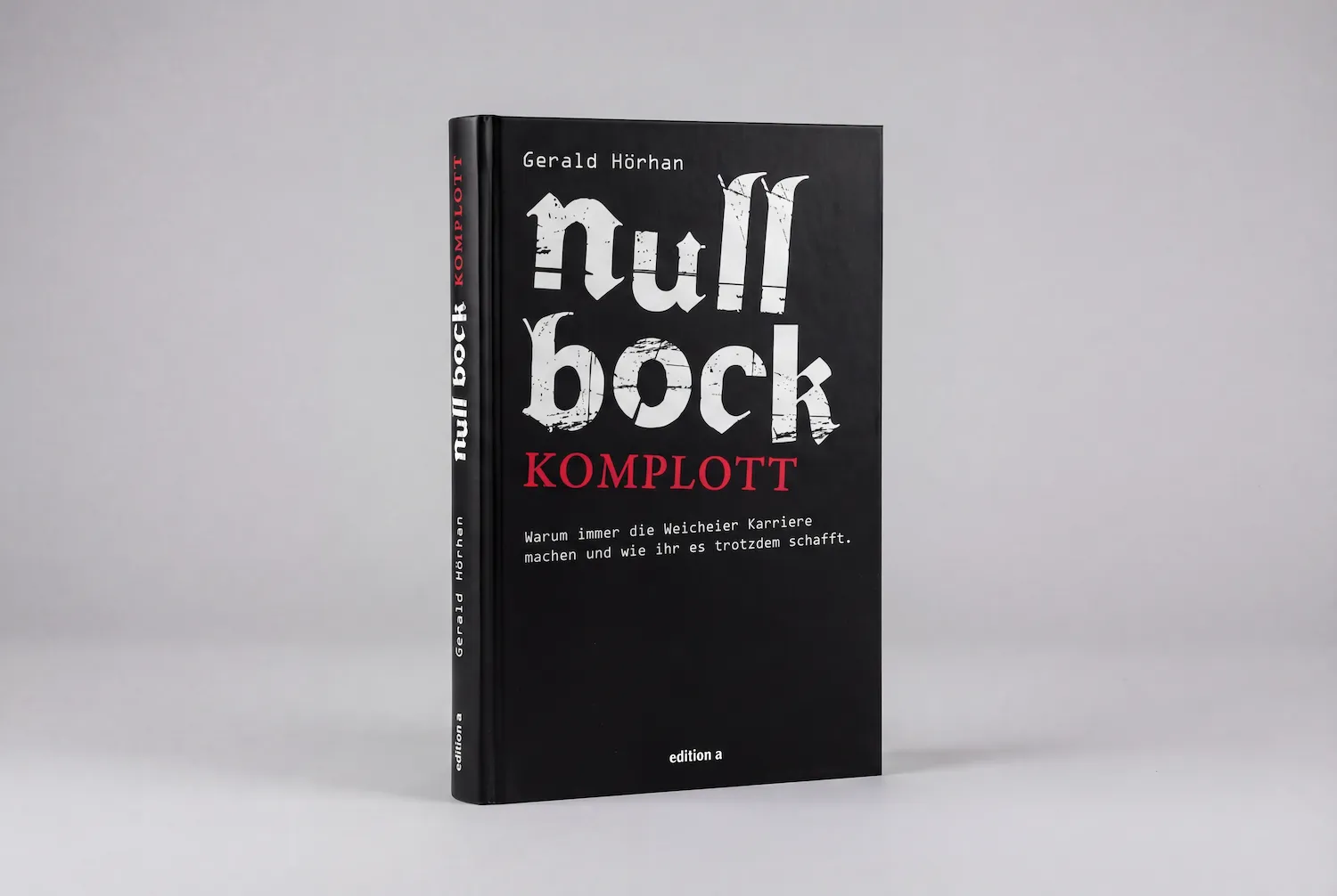 Schwarz-weißes Buch mit dem Titel 'null bock KOMPLOTT' von Gerald Hörhan vor grauem Hintergrund.