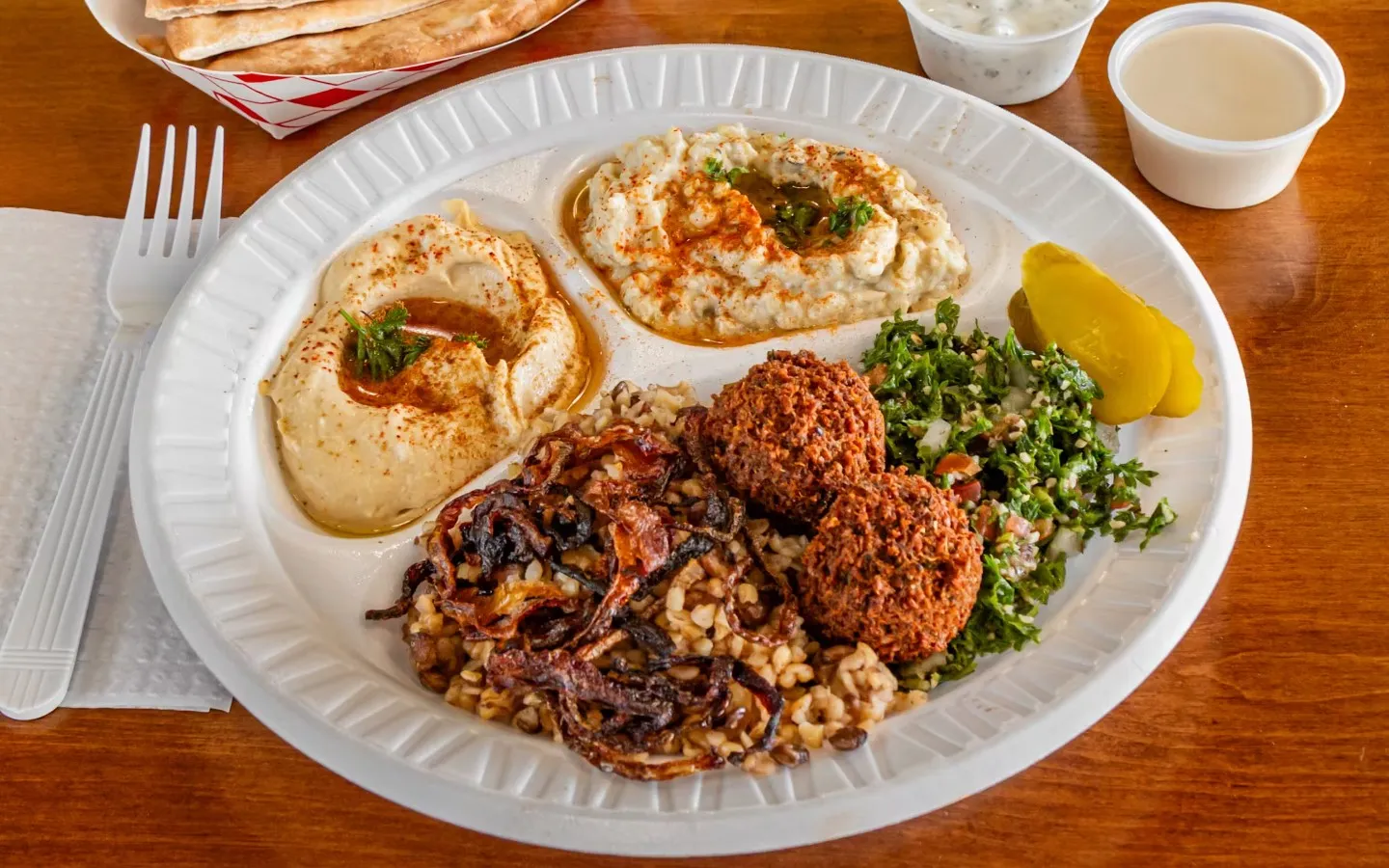 A white plate with a variety of foods on it.