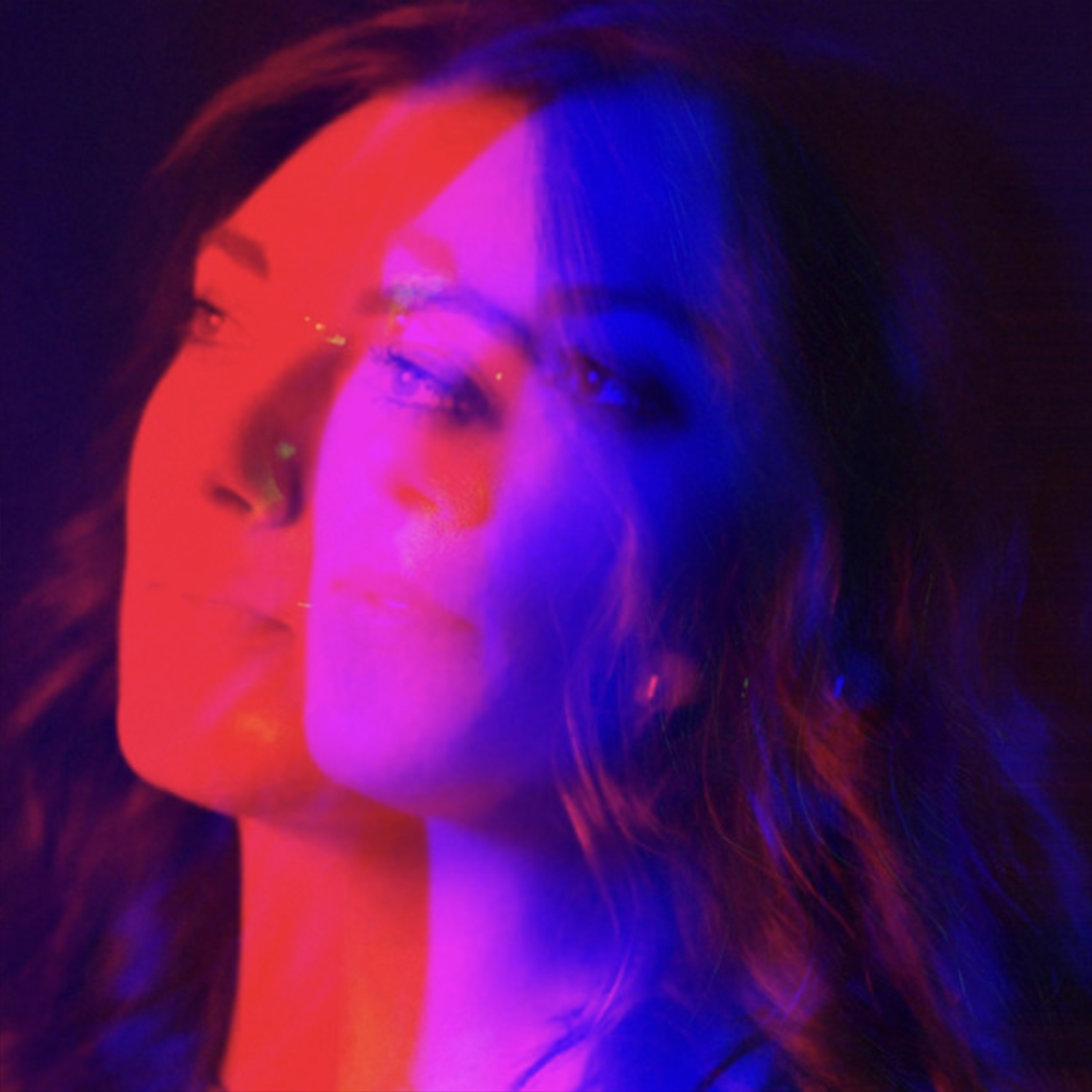 Portrait of a woman overlaid with overlapping red and blue color effects on a dark background.