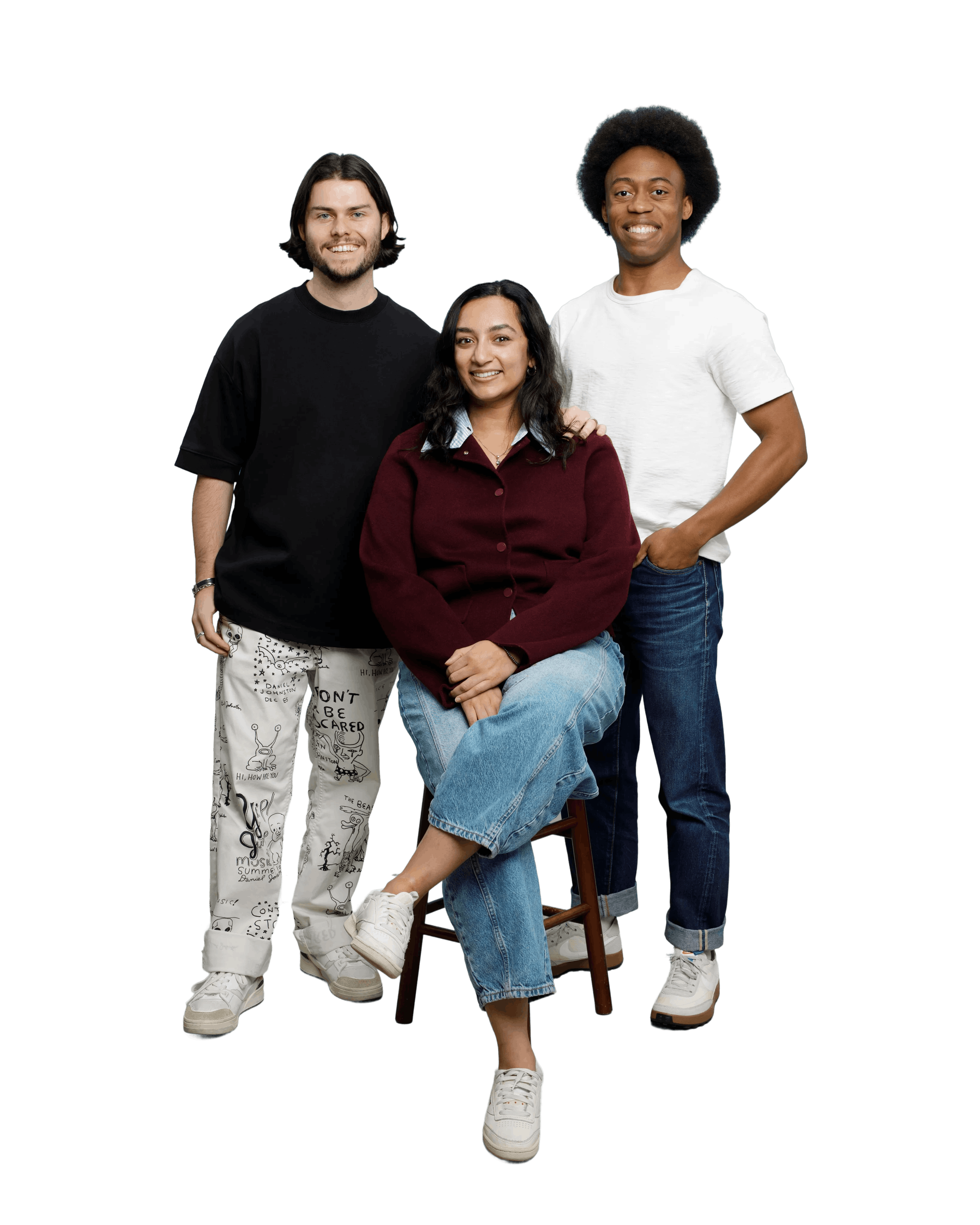 Group photo of the founding team: Alex and Jumar standing with Tara seated in between them