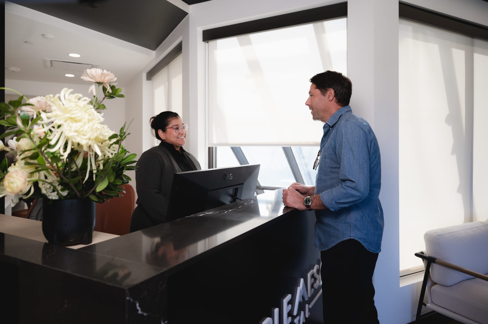 Patient and dentist in consultation discussing treatment timeline