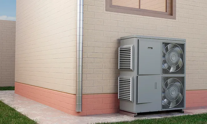 Exterior view of a grey HVAC unit with two fans installed on the ground outside a beige brick house with a pink brick foundation.