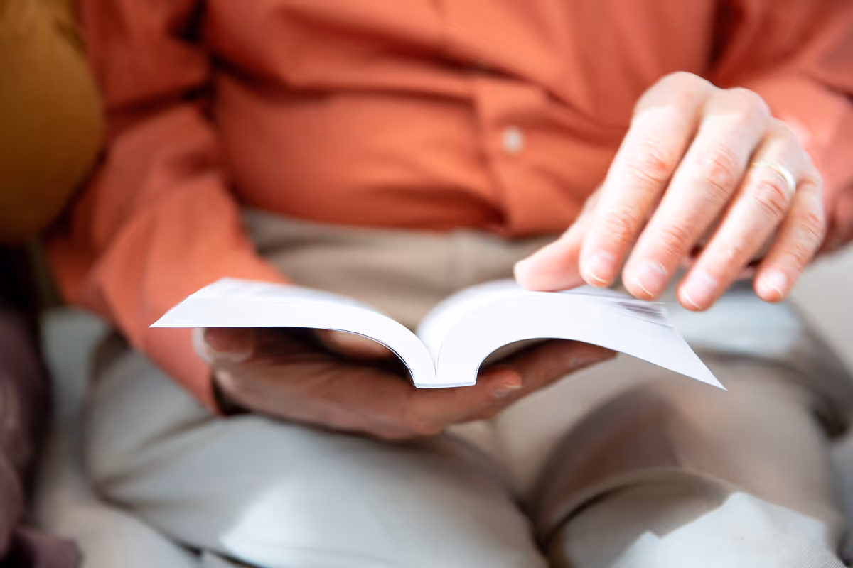 Person reading New Testament Recovery version