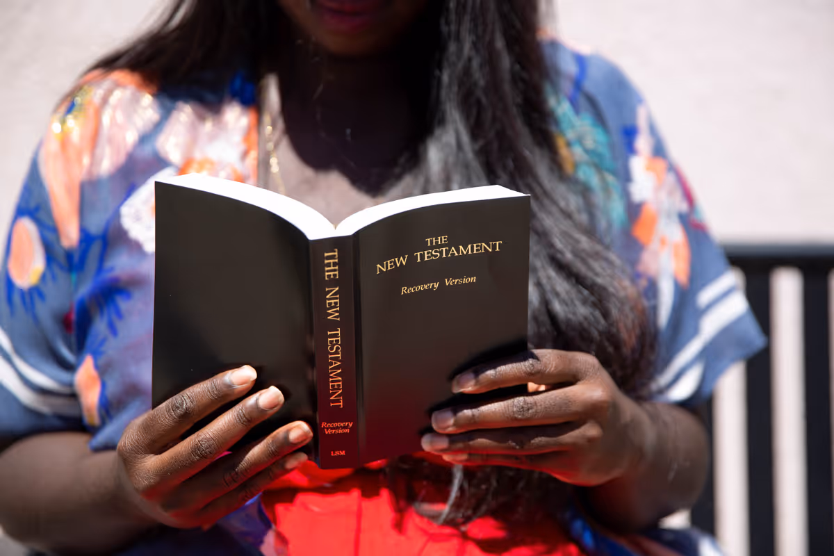 Person reading New Testament Recovery version