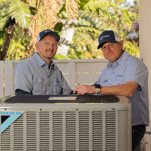 TrueBlue Air & Services technicians consulting with a Venice homeowner about AC options