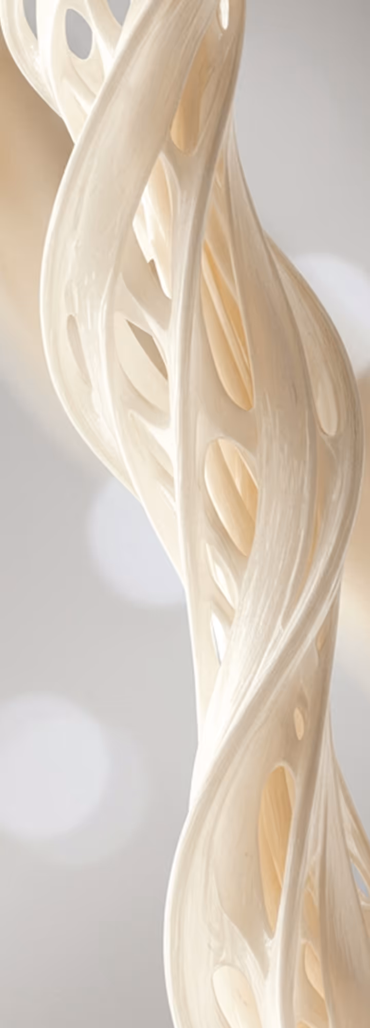 Close-up of a twisted, beige, sculptural form with elongated oval cutouts against a blurred light gray background.