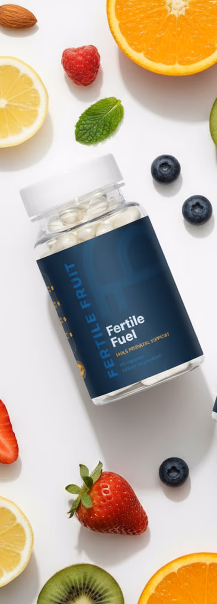 Bottle of Fertile Fuel supplement surrounded by various fruits including orange, lemon, strawberry, kiwi, raspberry, blueberries, and a mint leaf on a white background.