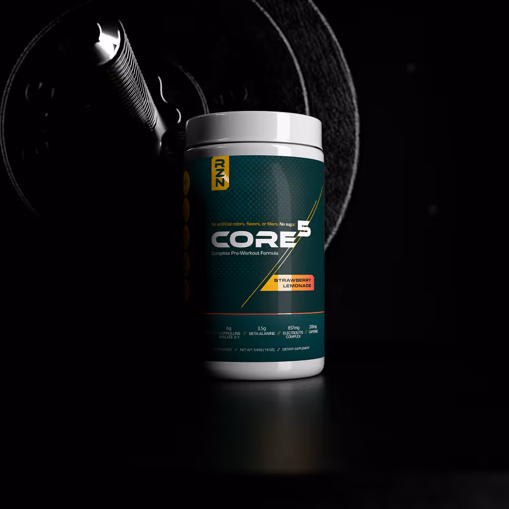 Container of RZN Core 5 pre-workout supplement in strawberry lemonade flavor with a barbell plate in the background.